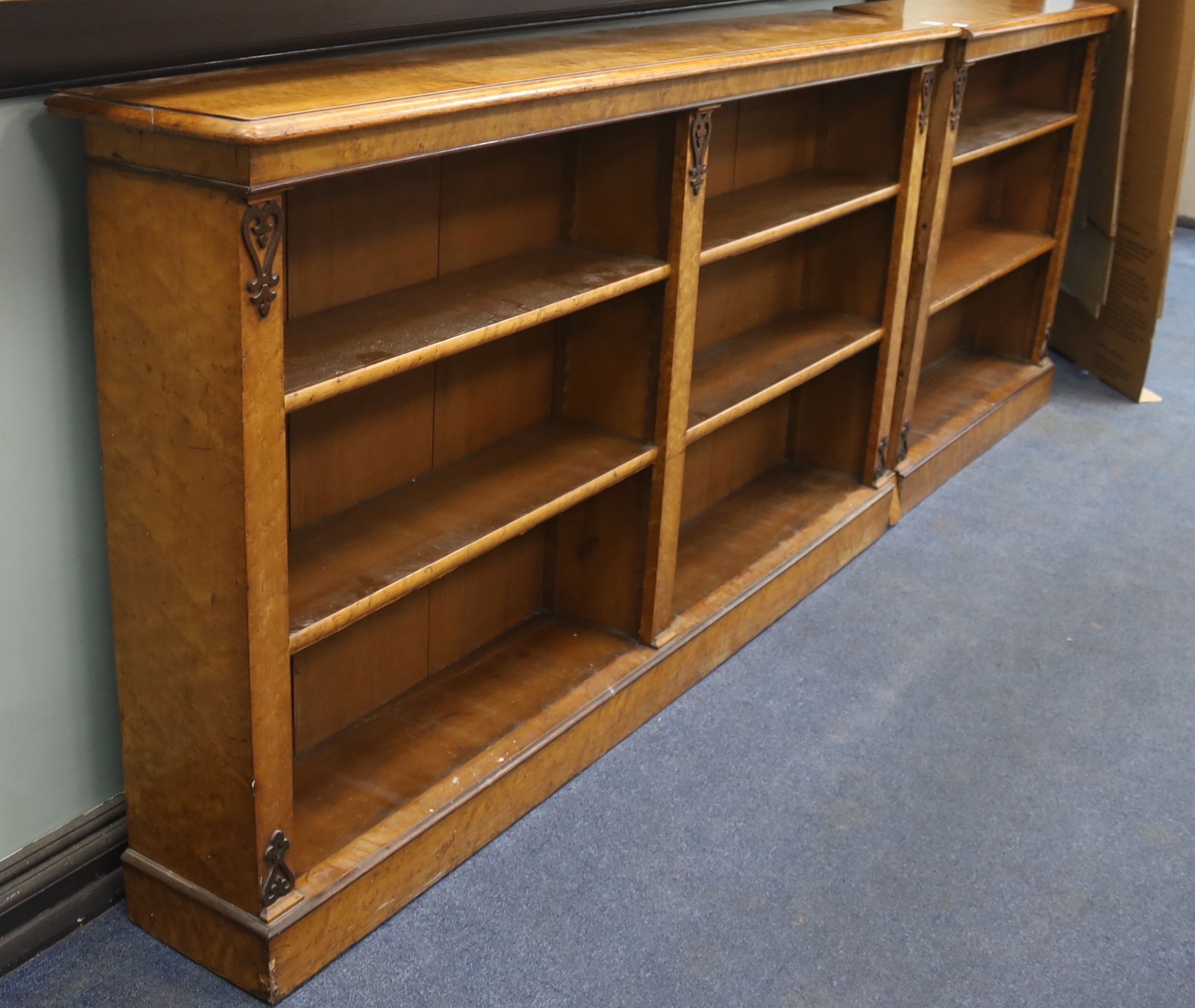 A Victorian two sectional (converted) bird's eye maple open bookcase, length 268cm, depth 27cm, height 94cm
